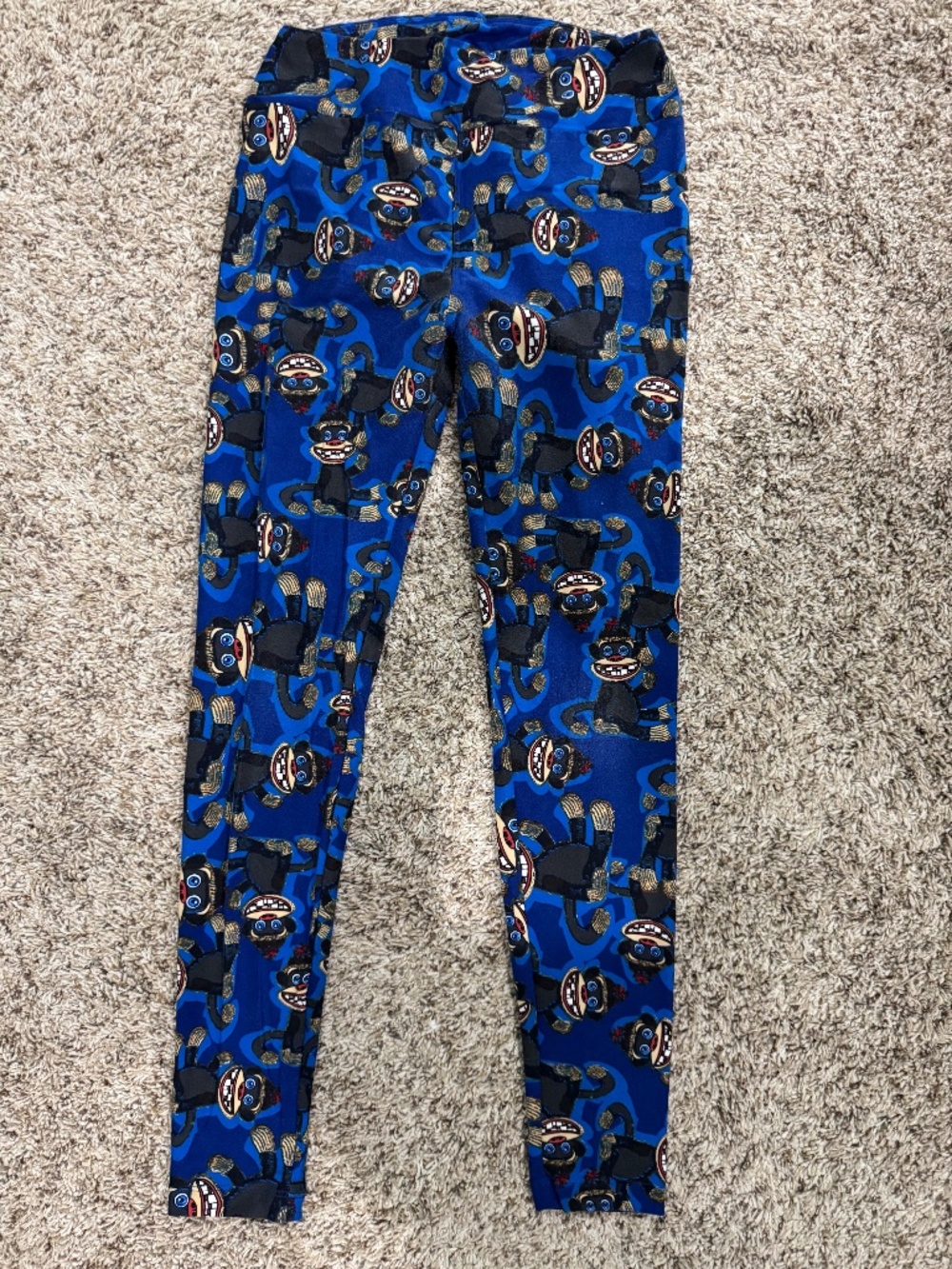 LuLaRoe black sock monkey leggings with blue background OS fits 2-10